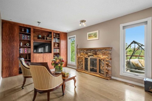 34 Cascade Place, Cochrane, AB - Indoor Photo Showing Living Room With Fireplace