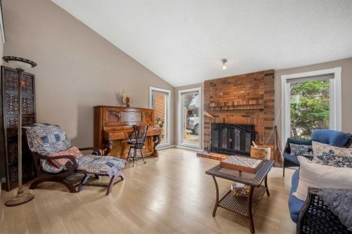 34 Cascade Place, Cochrane, AB - Indoor Photo Showing Living Room With Fireplace