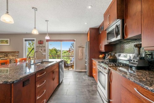 34 Cascade Place, Cochrane, AB - Indoor Photo Showing Kitchen With Double Sink