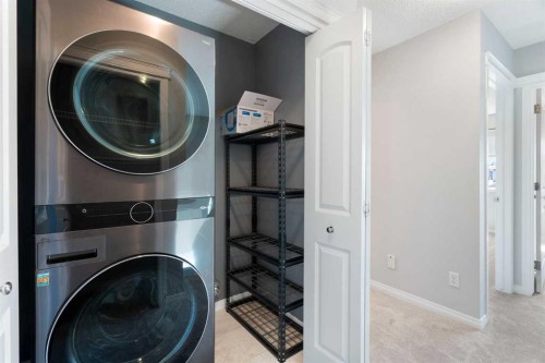 128 Silverado Way Sw, Calgary, AB - Indoor Photo Showing Laundry Room