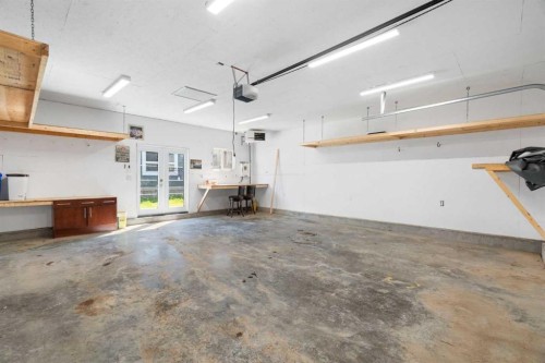 128 Silverado Way Sw, Calgary, AB - Indoor Photo Showing Garage