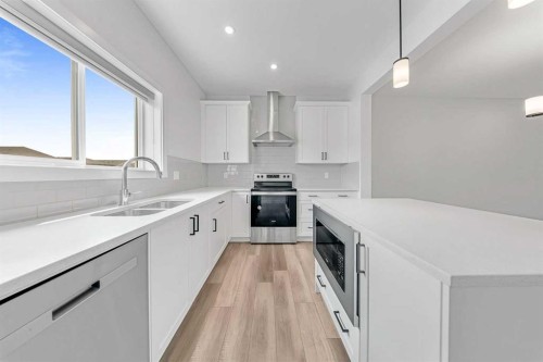 834 Bayview Terrace Sw, Airdrie, AB - Indoor Photo Showing Kitchen With Stainless Steel Kitchen With Double Sink With Upgraded Kitchen