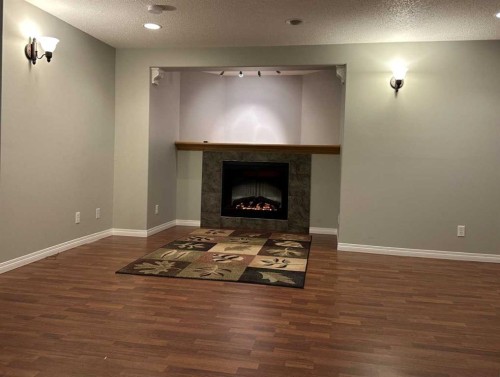 151 Citadel Green Nw, Calgary, AB - Indoor Photo Showing Living Room With Fireplace