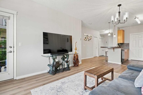 208-25 Prestwick Drive Se, Calgary, AB - Indoor Photo Showing Living Room