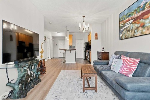 208-25 Prestwick Drive Se, Calgary, AB - Indoor Photo Showing Living Room