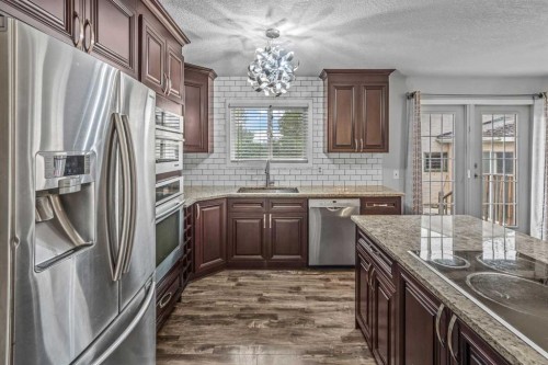227 Manora Crescent Ne, Calgary, AB - Indoor Photo Showing Kitchen With Stainless Steel Kitchen With Upgraded Kitchen