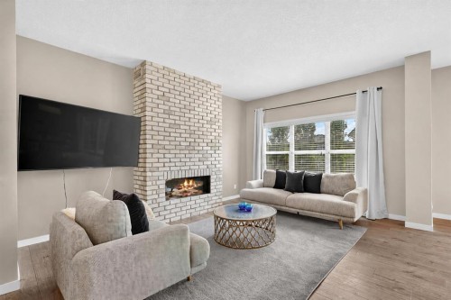 195 Mahogany Passage Se, Calgary, AB - Indoor Photo Showing Living Room With Fireplace