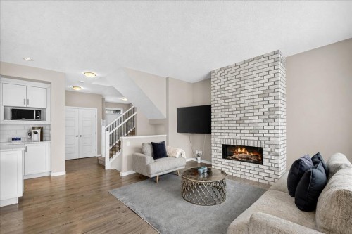 195 Mahogany Passage Se, Calgary, AB - Indoor Photo Showing Living Room With Fireplace