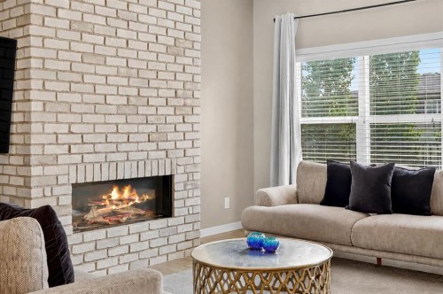 195 Mahogany Passage Se, Calgary, AB - Indoor Photo Showing Living Room With Fireplace