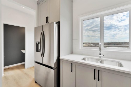 65 Lewiston Street Ne, Calgary, AB - Indoor Photo Showing Kitchen With Double Sink