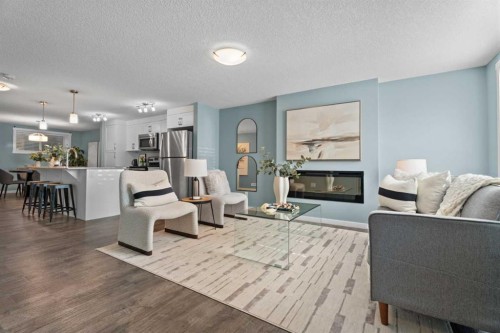 516 Auburn Bay Circle Se, Calgary, AB - Indoor Photo Showing Living Room With Fireplace