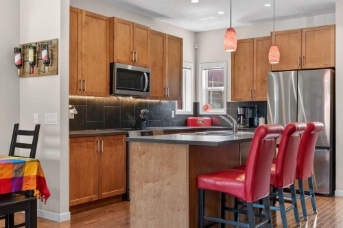 218 River Heights Green, Cochrane, AB - Indoor Photo Showing Kitchen With Stainless Steel Kitchen