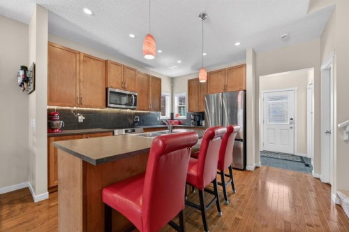 218 River Heights Green, Cochrane, AB - Indoor Photo Showing Kitchen With Stainless Steel Kitchen With Double Sink