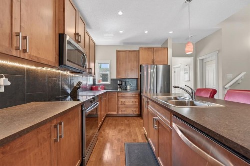 218 River Heights Green, Cochrane, AB - Indoor Photo Showing Kitchen With Double Sink