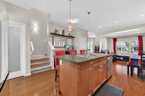 218 River Heights Green, Cochrane, AB - Indoor Photo Showing Kitchen With Double Sink