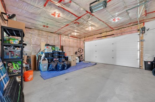 218 River Heights Green, Cochrane, AB - Indoor Photo Showing Garage