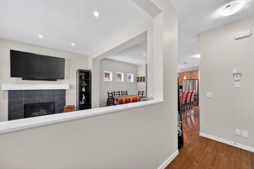 218 River Heights Green, Cochrane, AB - Indoor With Fireplace