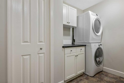 443 Riverside Green Nw, High River, AB - Indoor Photo Showing Laundry Room