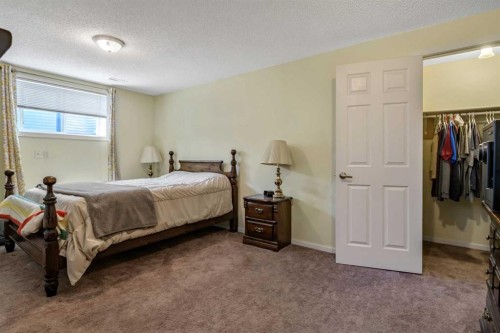 443 Riverside Green Nw, High River, AB - Indoor Photo Showing Bedroom