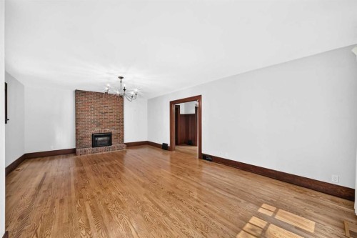 226 Superior Avenue Sw, Calgary, AB - Indoor Photo Showing Other Room With Fireplace