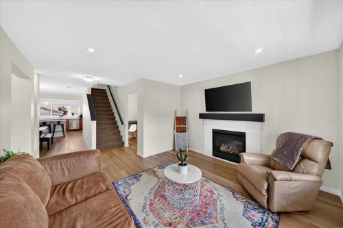 138 Copperpond Heights Se, Calgary, AB - Indoor Photo Showing Living Room With Fireplace