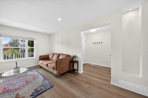138 Copperpond Heights Se, Calgary, AB - Indoor Photo Showing Living Room