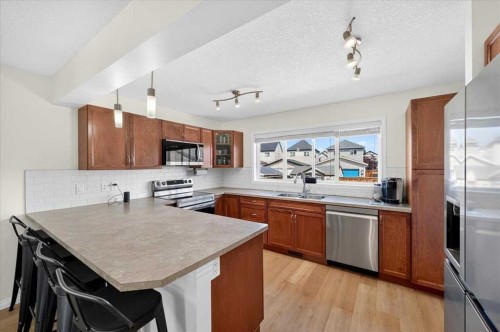 138 Copperpond Heights Se, Calgary, AB - Indoor Photo Showing Kitchen With Stainless Steel Kitchen With Double Sink