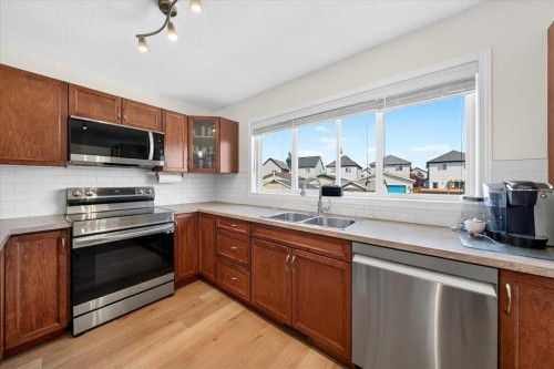 138 Copperpond Heights Se, Calgary, AB - Indoor Photo Showing Kitchen With Stainless Steel Kitchen With Double Sink
