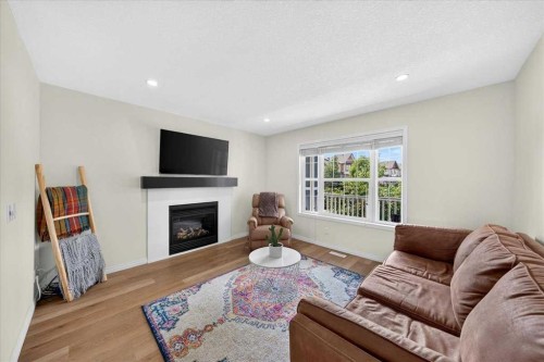 138 Copperpond Heights Se, Calgary, AB - Indoor Photo Showing Living Room With Fireplace