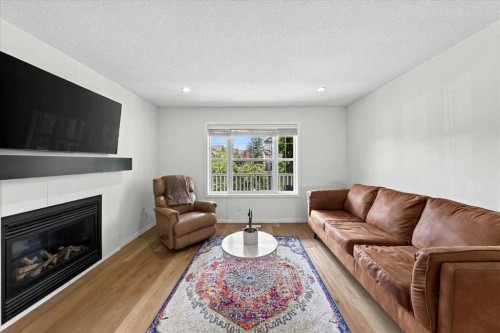 138 Copperpond Heights Se, Calgary, AB - Indoor Photo Showing Living Room With Fireplace