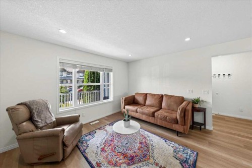 138 Copperpond Heights Se, Calgary, AB - Indoor Photo Showing Living Room