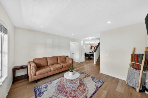 138 Copperpond Heights Se, Calgary, AB - Indoor Photo Showing Living Room