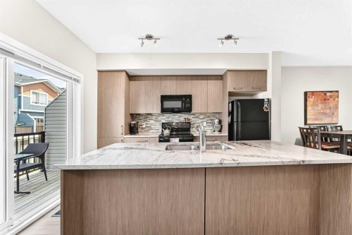 7 Stonehouse Crescent Nw, High River, AB - Indoor Photo Showing Kitchen With Double Sink