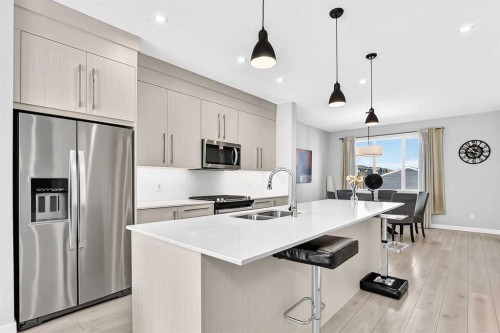 197 Chelsea Drive, Chestermere, AB - Indoor Photo Showing Kitchen With Double Sink With Upgraded Kitchen