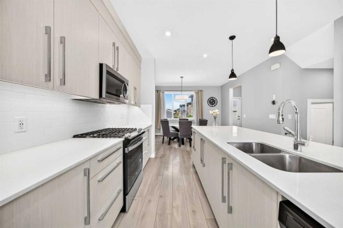 197 Chelsea Drive, Chestermere, AB - Indoor Photo Showing Kitchen With Double Sink With Upgraded Kitchen