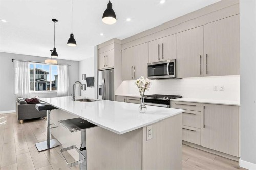 197 Chelsea Drive, Chestermere, AB - Indoor Photo Showing Kitchen With Double Sink With Upgraded Kitchen