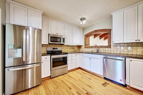 4820 49 Avenue Nw, Calgary, AB - Indoor Photo Showing Kitchen With Stainless Steel Kitchen
