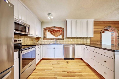 4820 49 Avenue Nw, Calgary, AB - Indoor Photo Showing Kitchen With Stainless Steel Kitchen