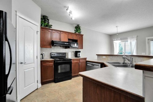 292 Taralake Terrace Ne, Calgary, AB - Indoor Photo Showing Kitchen With Double Sink