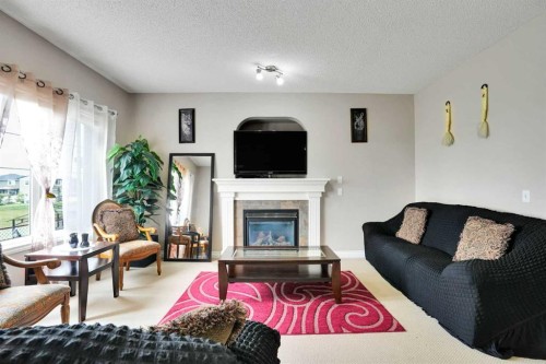 292 Taralake Terrace Ne, Calgary, AB - Indoor Photo Showing Living Room With Fireplace
