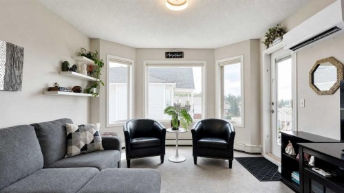 515-3515 Hawksbrow Point Nw, Calgary, AB - Indoor Photo Showing Living Room
