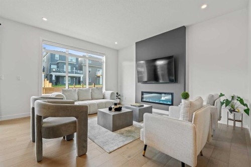 389 Crimson Ridge Place Nw, Calgary, AB - Indoor Photo Showing Living Room With Fireplace