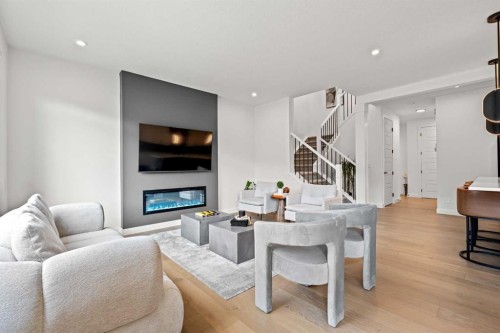 389 Crimson Ridge Place Nw, Calgary, AB - Indoor Photo Showing Living Room With Fireplace