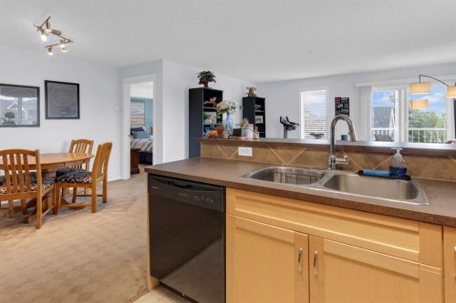 7201-70 Panamount Drive Nw, Calgary, AB - Indoor Photo Showing Kitchen With Double Sink