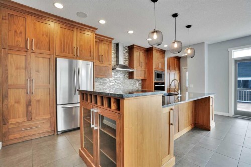 145 Marquis Common Se, Calgary, AB - Indoor Photo Showing Kitchen With Stainless Steel Kitchen With Upgraded Kitchen