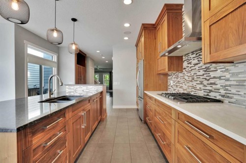 145 Marquis Common Se, Calgary, AB - Indoor Photo Showing Kitchen With Double Sink With Upgraded Kitchen