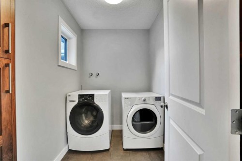 145 Marquis Common Se, Calgary, AB - Indoor Photo Showing Laundry Room