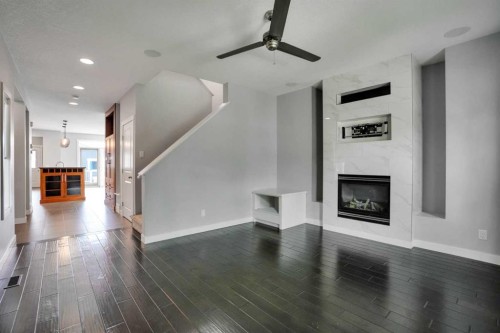 145 Marquis Common Se, Calgary, AB - Indoor With Fireplace