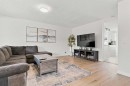 61 Mt Aberdeen Circle Se, Calgary, AB  - Indoor Photo Showing Living Room 