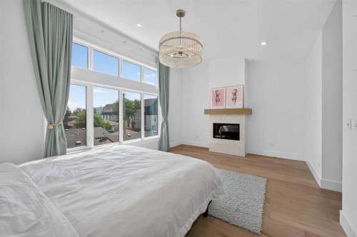 1704 26A Street Sw, Calgary, AB - Indoor Photo Showing Bedroom With Fireplace